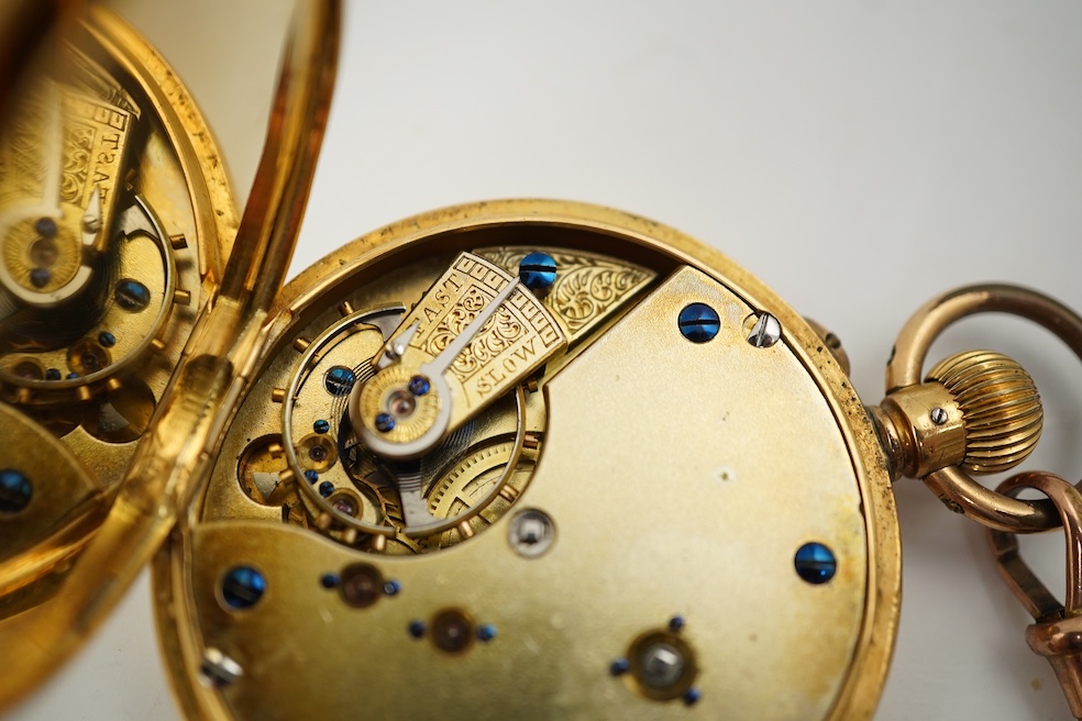 A continental 18k gold open faced keyless lever pocket watch, with a 9ct albert